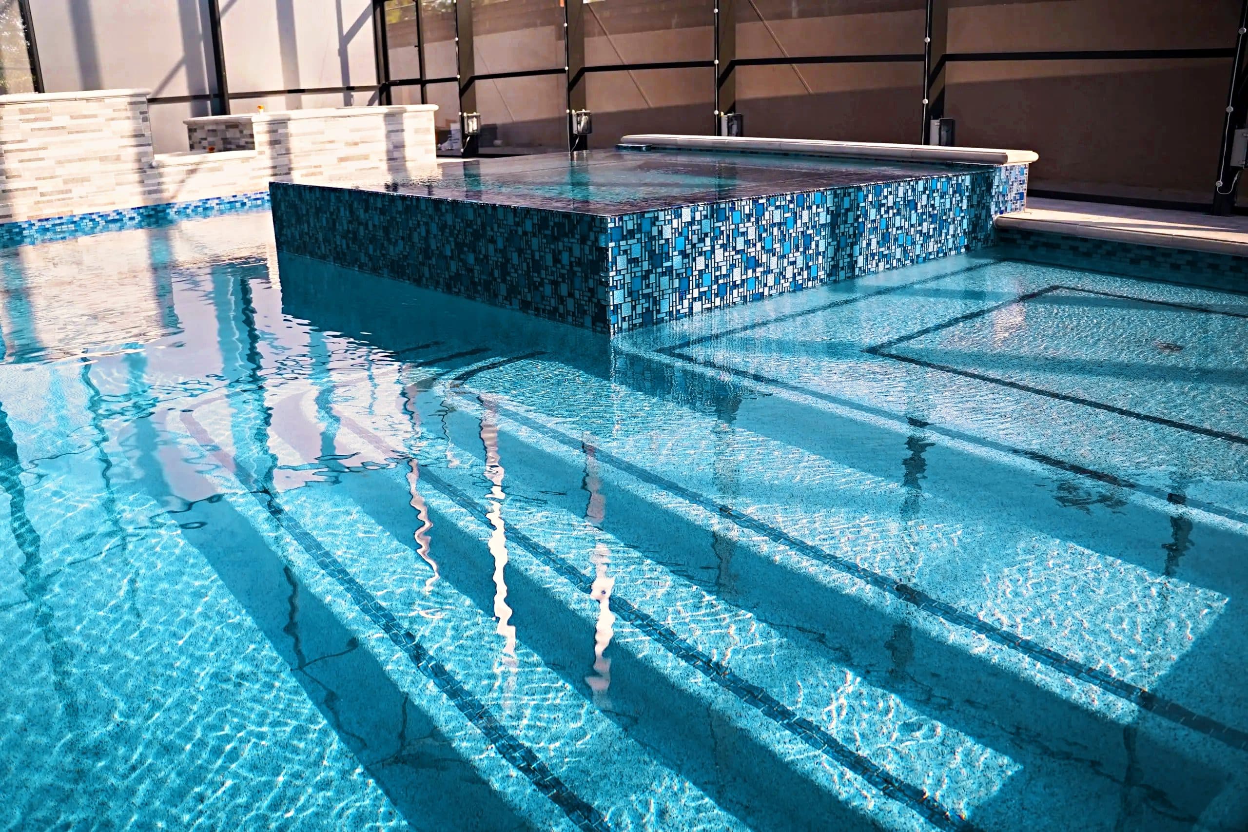 New blue glass tile on pool steps