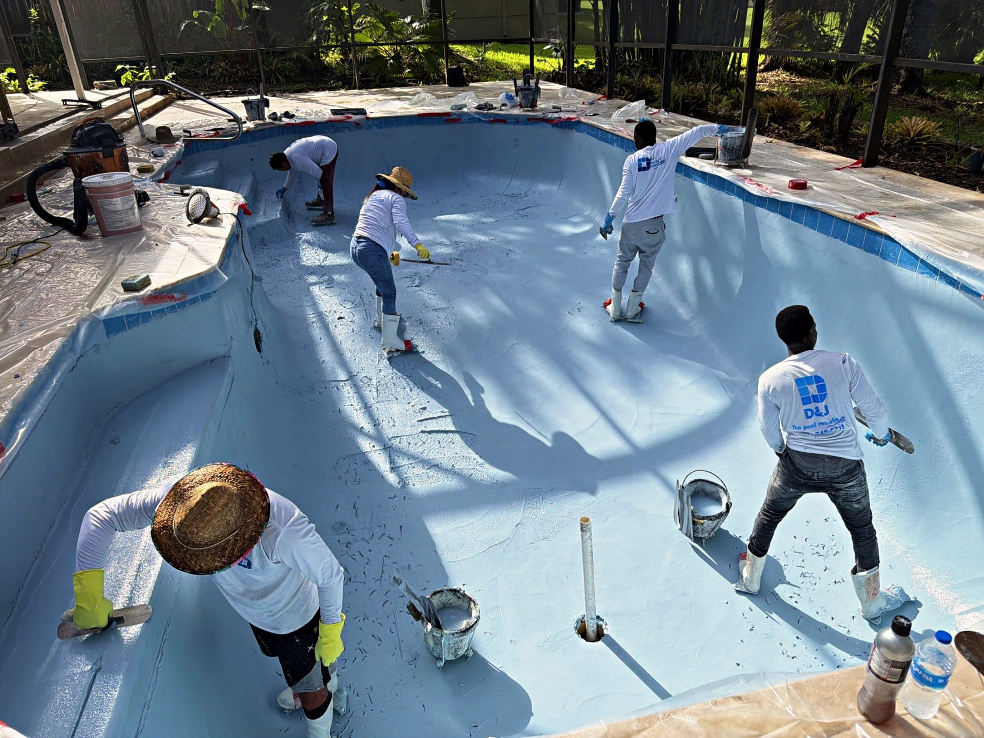 D&J crew hand-troweling a new finish