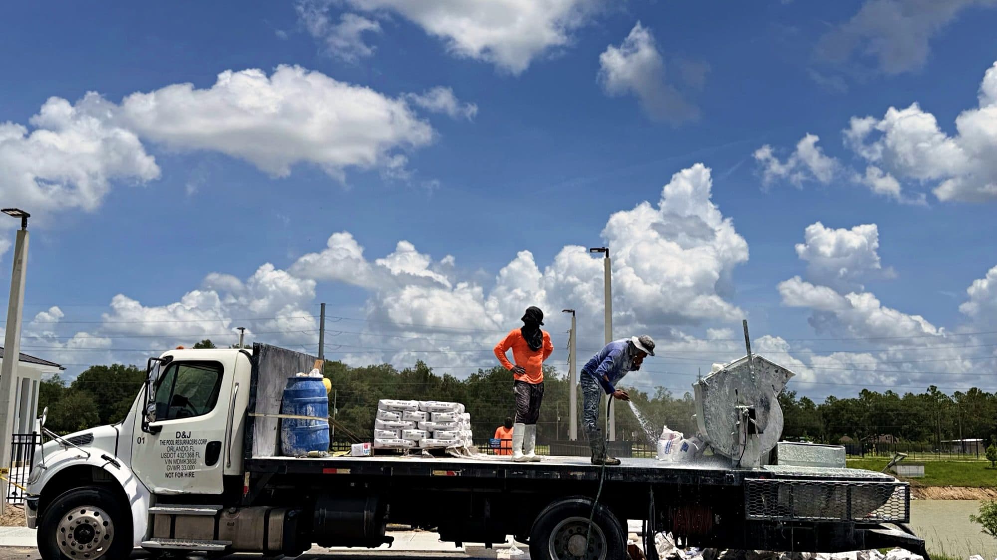 D&J's own work truck, lettered and DOT-registered, on a commercial job in Zephyrhills